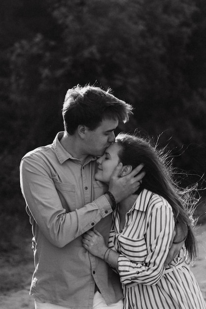 Happy loving couple on a lake beach