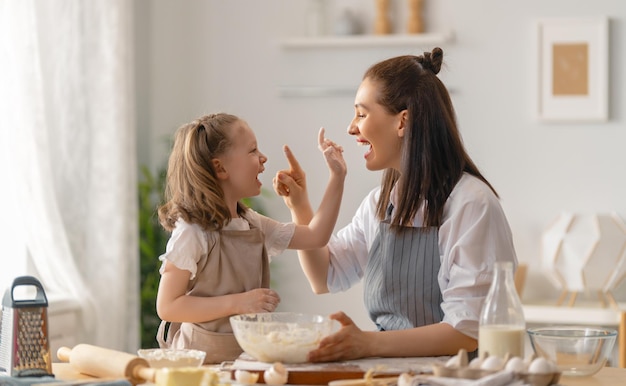 Happy loving family are preparing bakery together Mother and