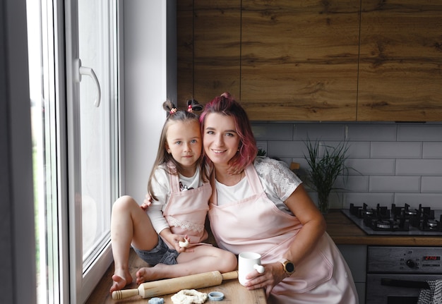 Happy loving family is preparing a bakery together