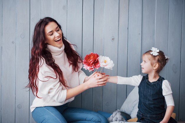 Happy loving family. Mother and her daughter child girl playing together