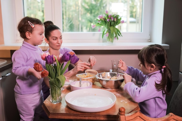 Happy loving family preparing bakery together in the kitchen