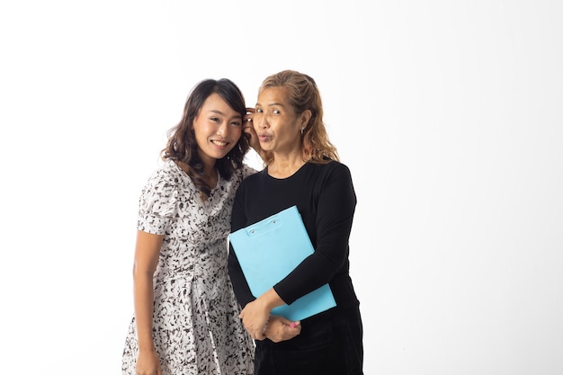 Happy loving older mother and young daughter laughing togetherness on white background