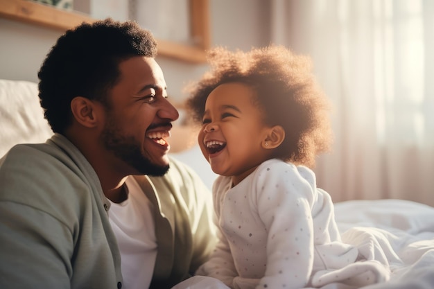 Happy loving young Black dad holding adorable mixed race baby daughter having fun in bed at home Smiling African father playing with cute funny infant child girl waking up in bedroom in the morning