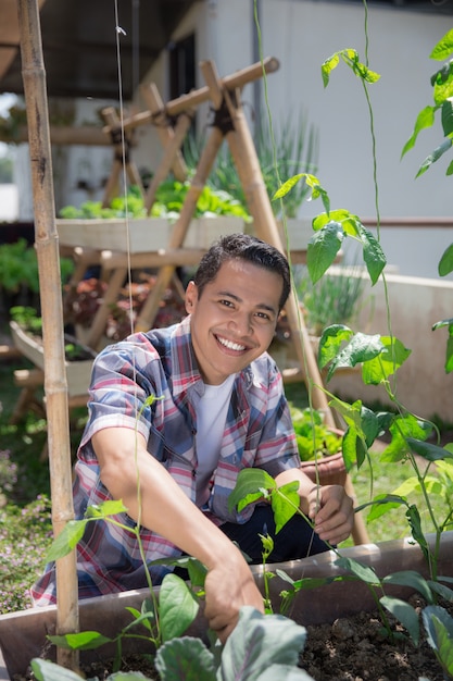 Happy male gardening