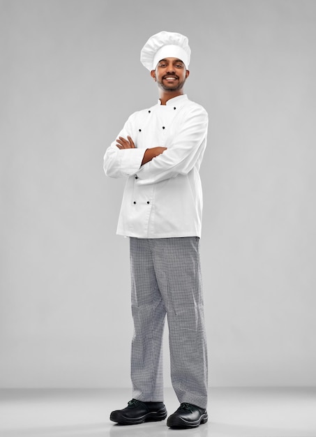 Photo happy male indian chef in toque