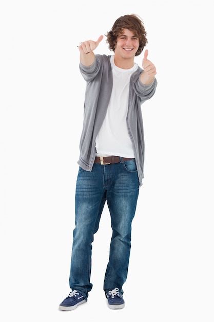 Happy male student posing the thumbs-up