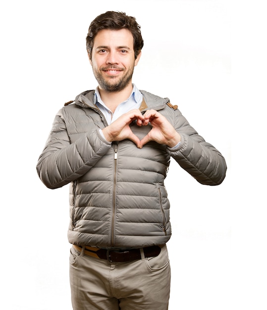 Happy man doing a love gesture