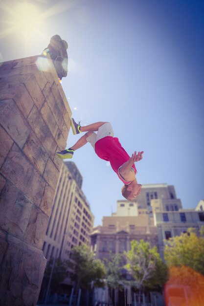 Happy man doing parkour