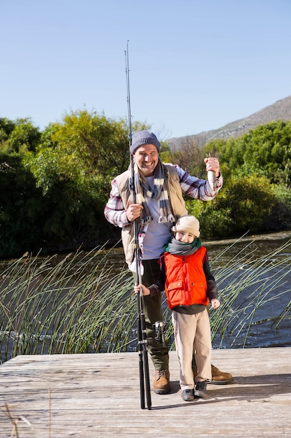 Happy man fishing with his son