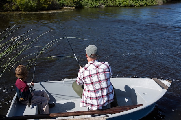 Happy man fishing with his son