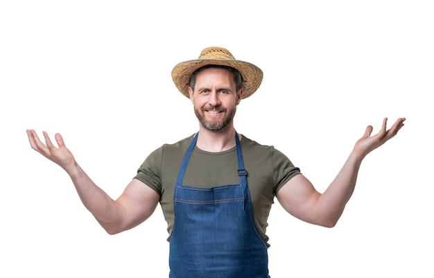 Happy man in hat and apron gesturing isolated on white background