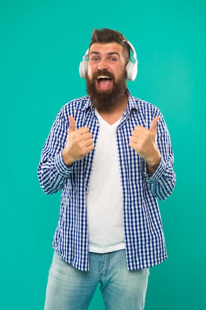 Happy man hipster listen to music mature hipster with beard bearded man hair and beard care music brutal caucasian hipster with moustache man in earphones young and brutal perfect paly list