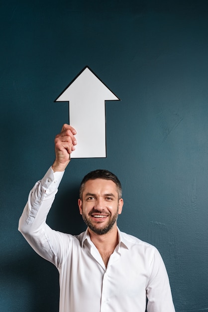 Happy man holding arrow.