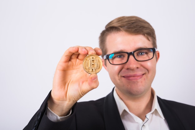 happy man holding bitcoin on white background