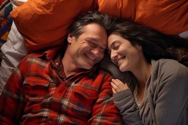 Photo happy man hugging his wife in bed