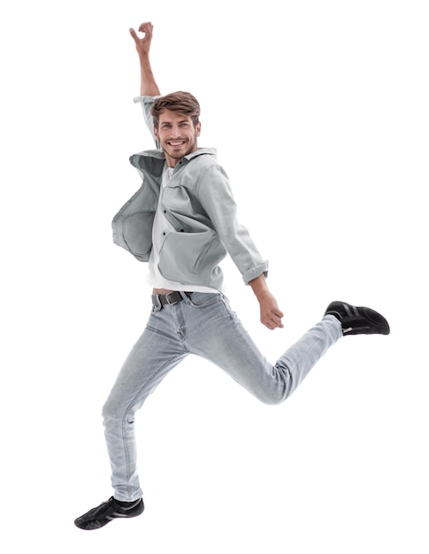 Happy man jumping in air over white background