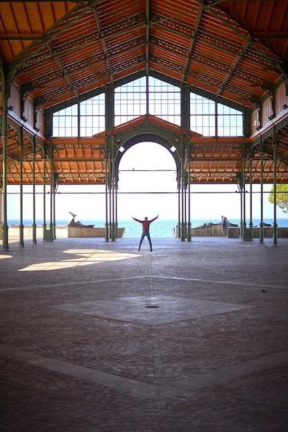 happy man jumping alone in the morning