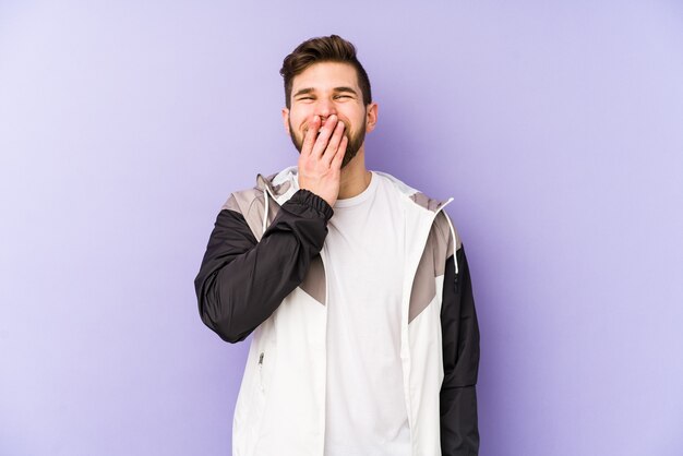 Happy man laughing in studio