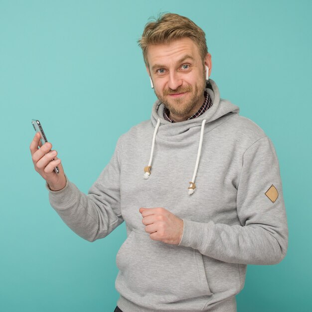 Happy Man listening to music with wireless earphones