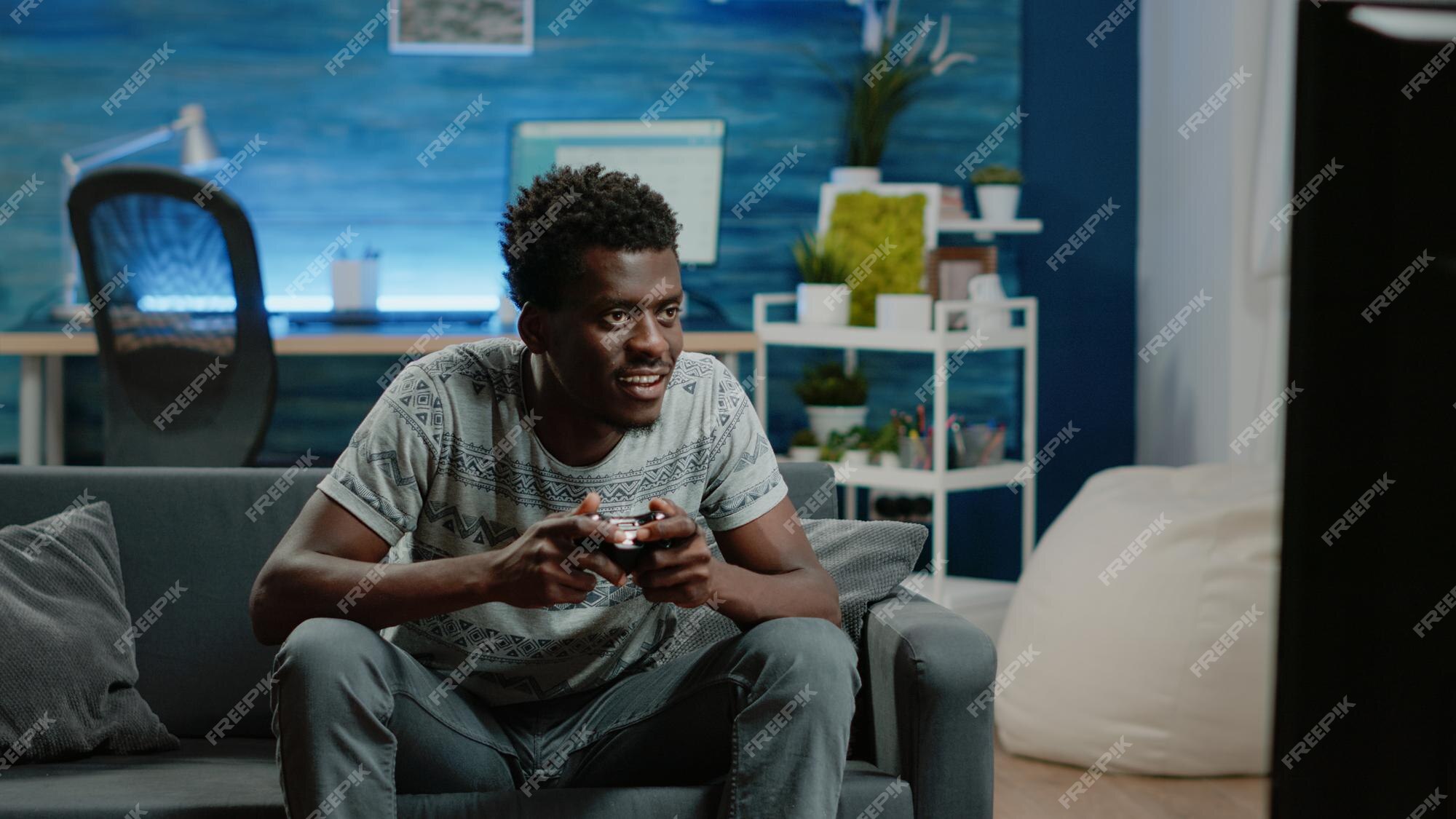 Having Fun at Home. Cheerful Black Teen Guy with Joystick Playing Online  Computer Games, Sitting on Couch Indoors Stock Image - Image of computer,  person: 227478857