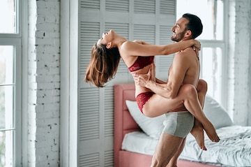 Premium Photo  The happy man playing with a sexy woman in underwear in a  bedroom