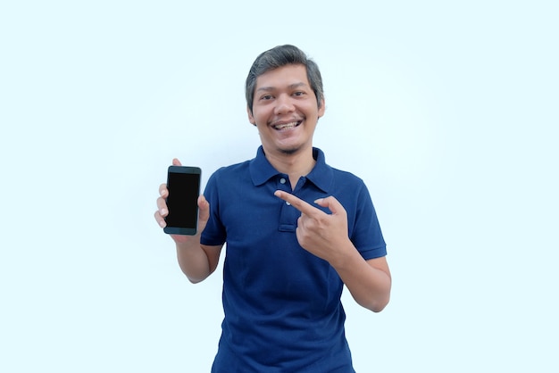 Happy man pointing finger to phone screen