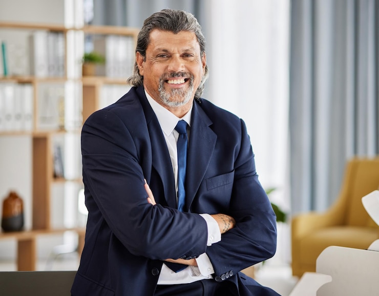 Photo happy man portrait and senior manager with confidence at law firm lawyer in office and leader in government judge attorney or businessman with smile arms crossed and experience in pride at job