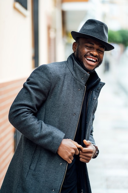 Happy man posing with hat