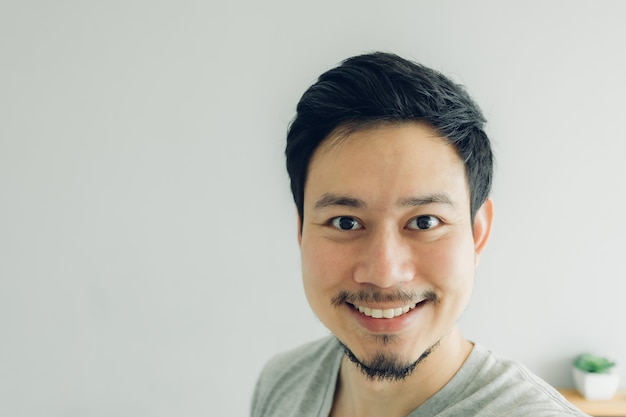 Happy man selfie in his condominium room.