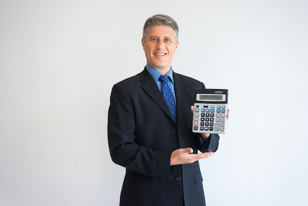 Happy man showing percentage rate on calculator