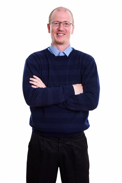 happy man smiling and standing with arms crossed isolated on white