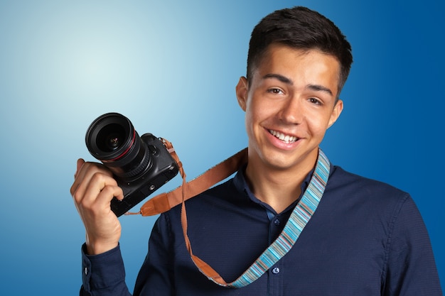 Happy man taking pictures with digital camera