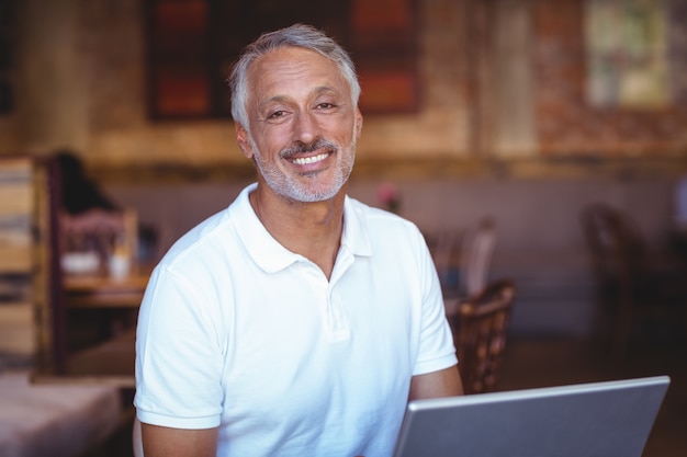  Happy man using his laptop computer