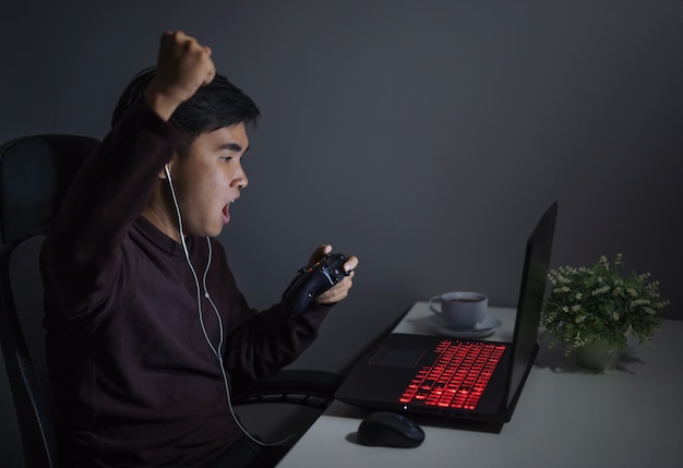 happy man using joystick to playing games