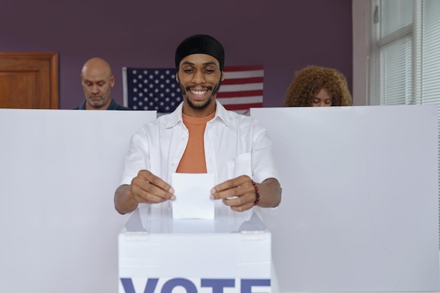 Happy man voting in election day