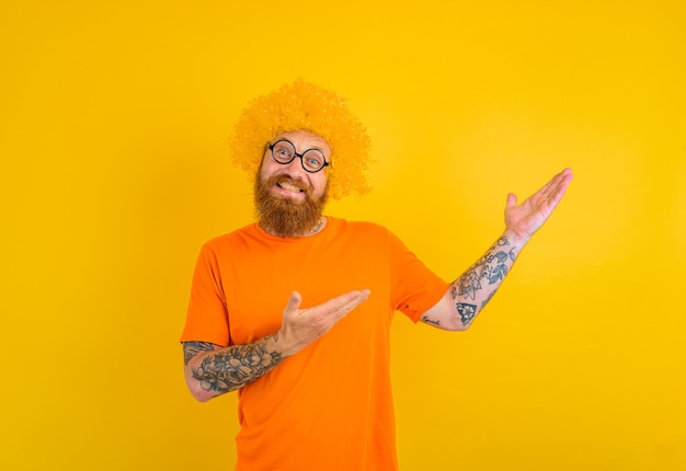 Happy man with beard, yellow wig and glasses