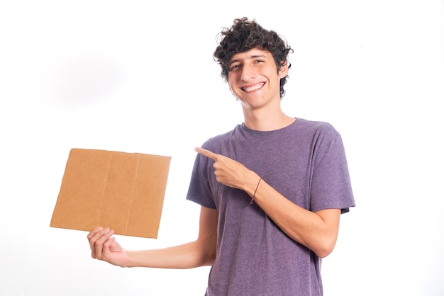 Happy man with blank cardboard sign for copy space isolated on white background