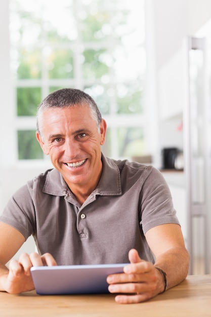 Happy man with tablet