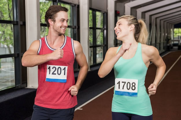 Happy man and woman running together