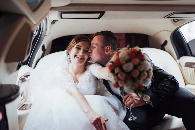 Happy man and woman smiling rejoicing in wedding day.