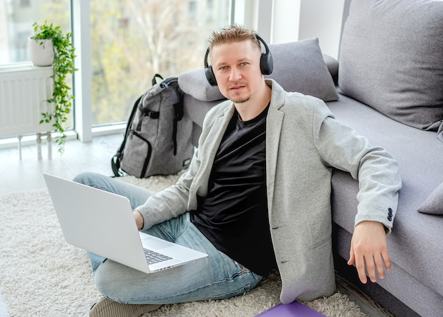 Happy man working on laptop