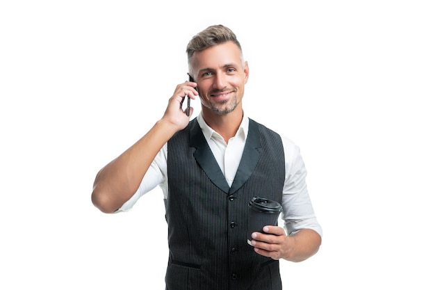 Happy manager talking on mobile phone during coffee break isolated on white