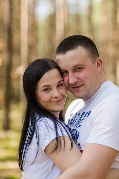 happy married couple in the forest