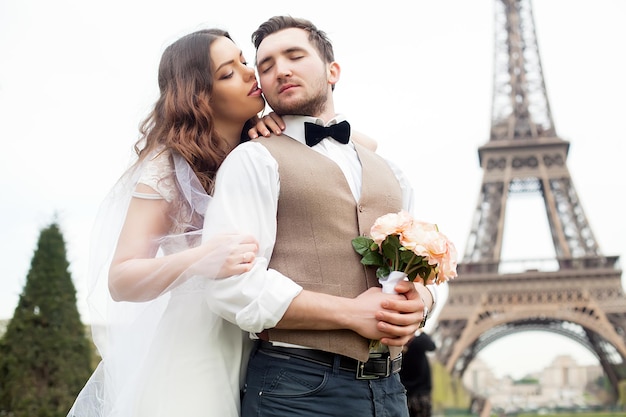 Happy married couple near the Eiffel Tower