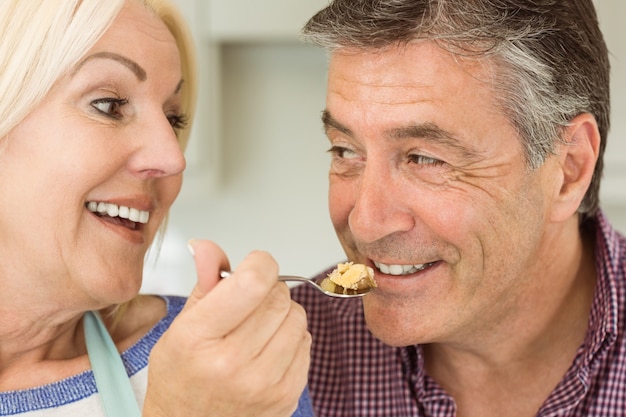 Happy mature blonde feeding pie to husband