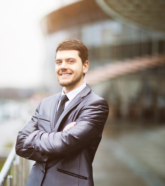 Happy mature business man looking at camera with satisfaction office