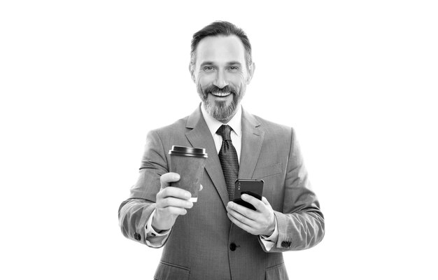 Happy mature ceo in suit chatting on phone and drink coffee isolated on white coffee break