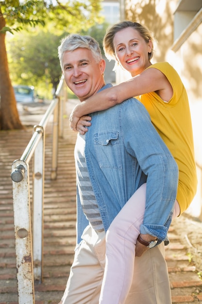 Happy mature couple having fun in the city