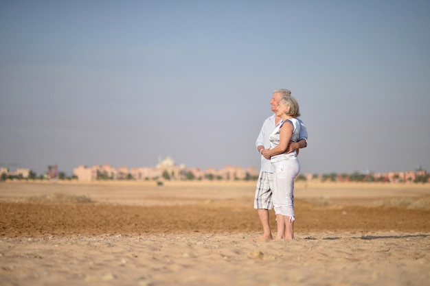 Happy Mature couple in love enjoy fresh air and stunning view on vacation