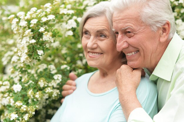 Happy mature couple in a spring park